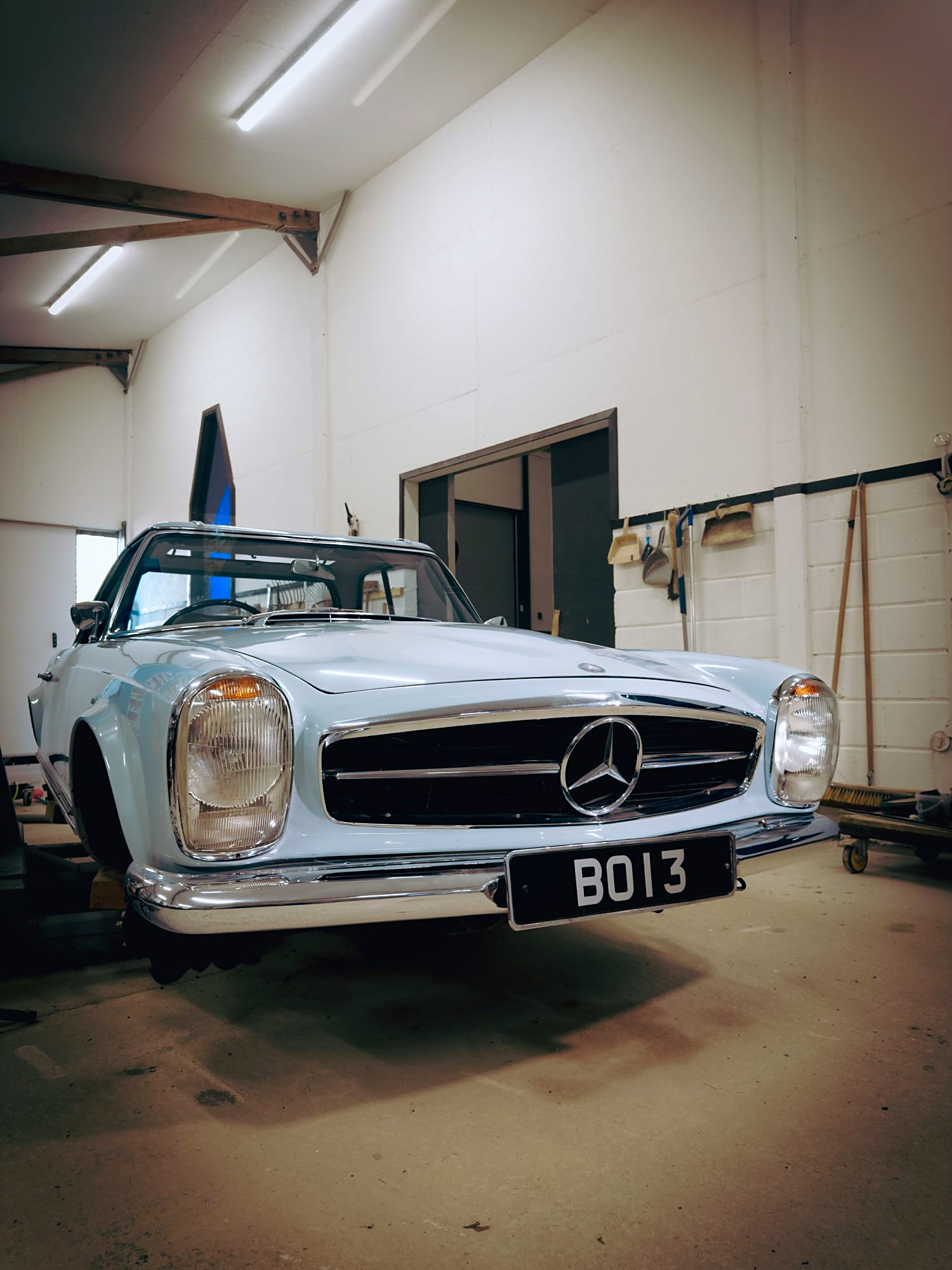 Three-quarter front view of the pale blue Pagoda in the workshop