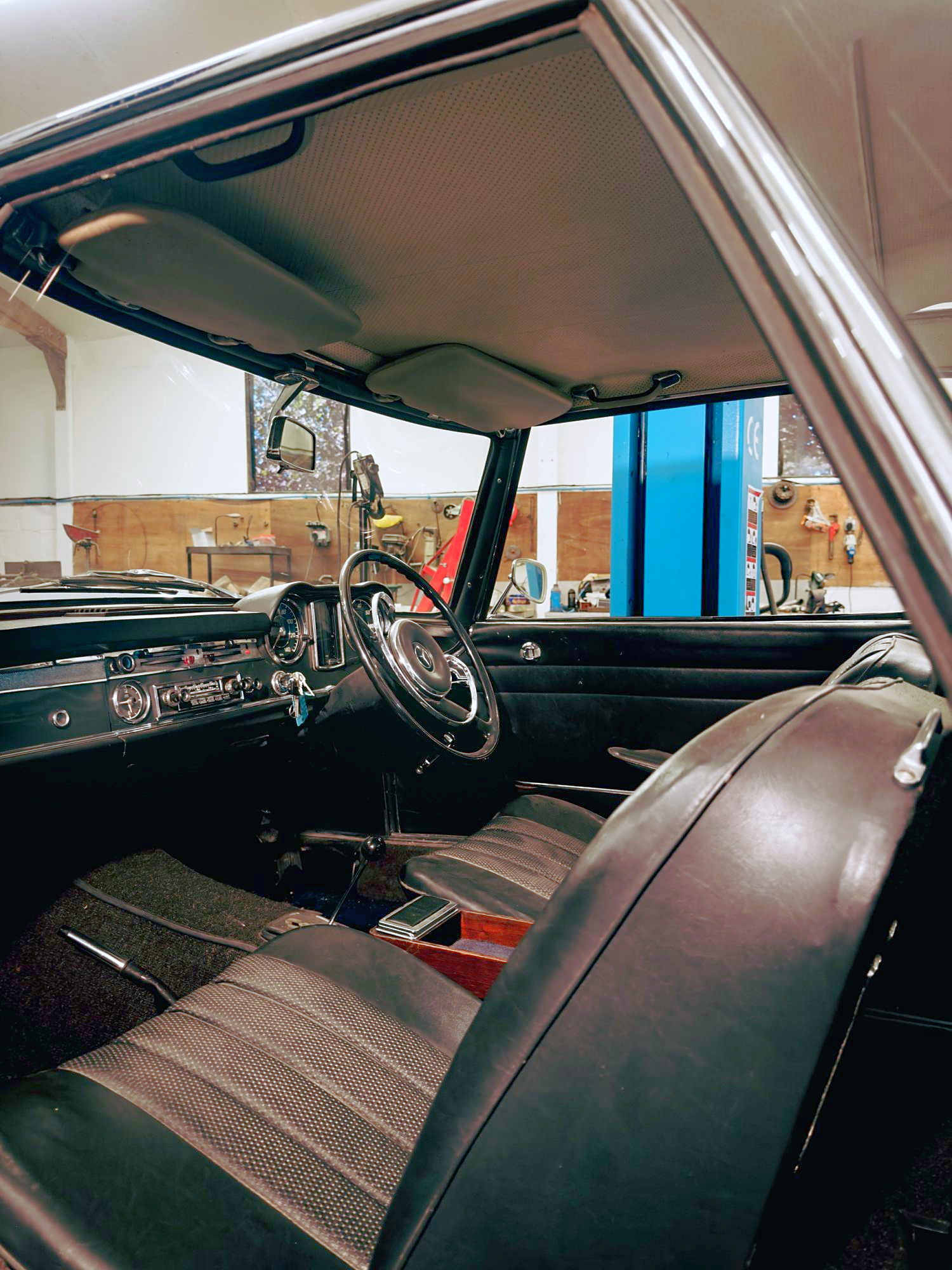 View into the Pagoda’s cabin showing the steering wheel, dashboard and leather seats